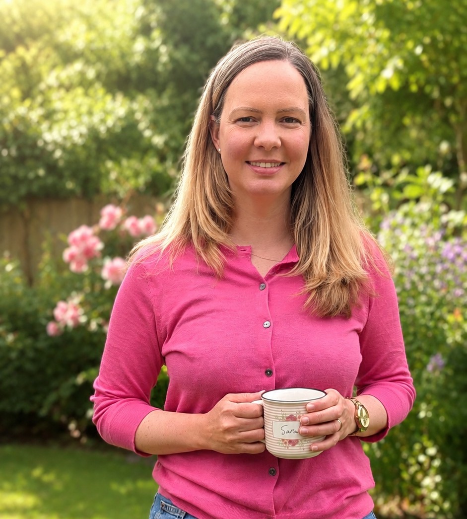 Sarah Durance holding a mug in a garden
